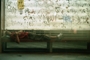 A homeless person is sleeping in a bus station in Bucharest